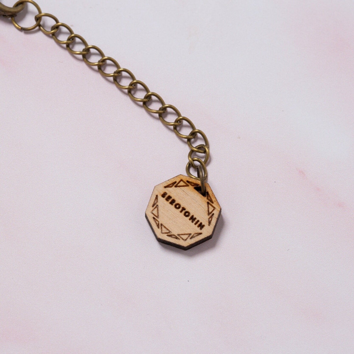 Serotonin molecule necklace: 'Happiness chemical'