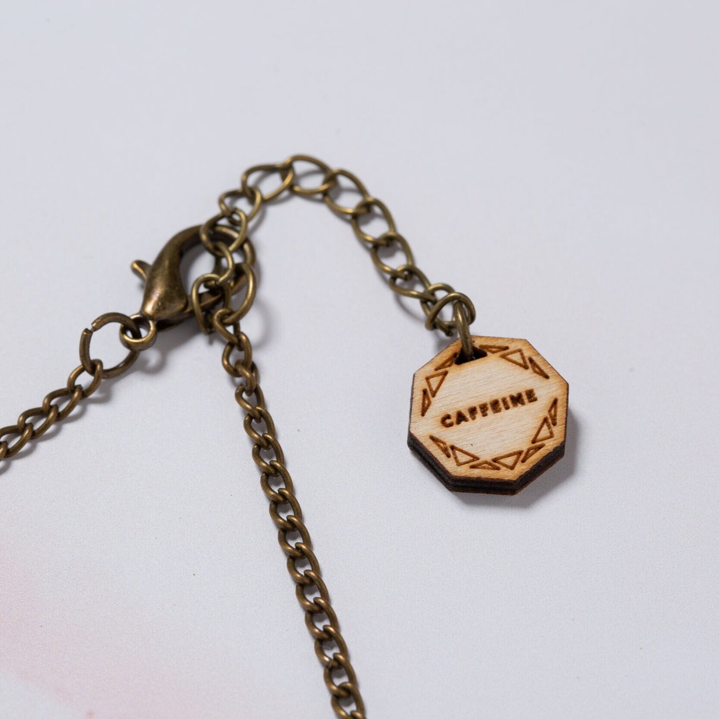 Caffeine molecule necklace