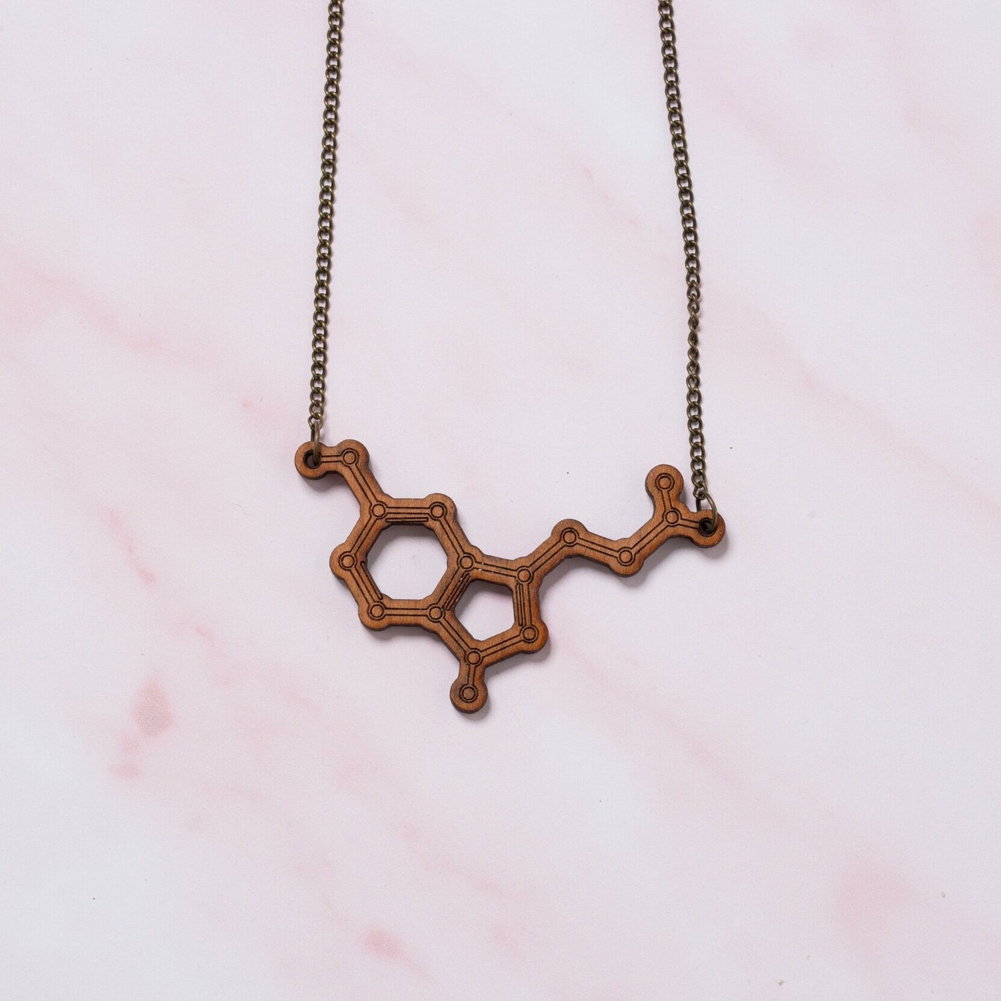 Serotonin molecule necklace: 'Happiness chemical'