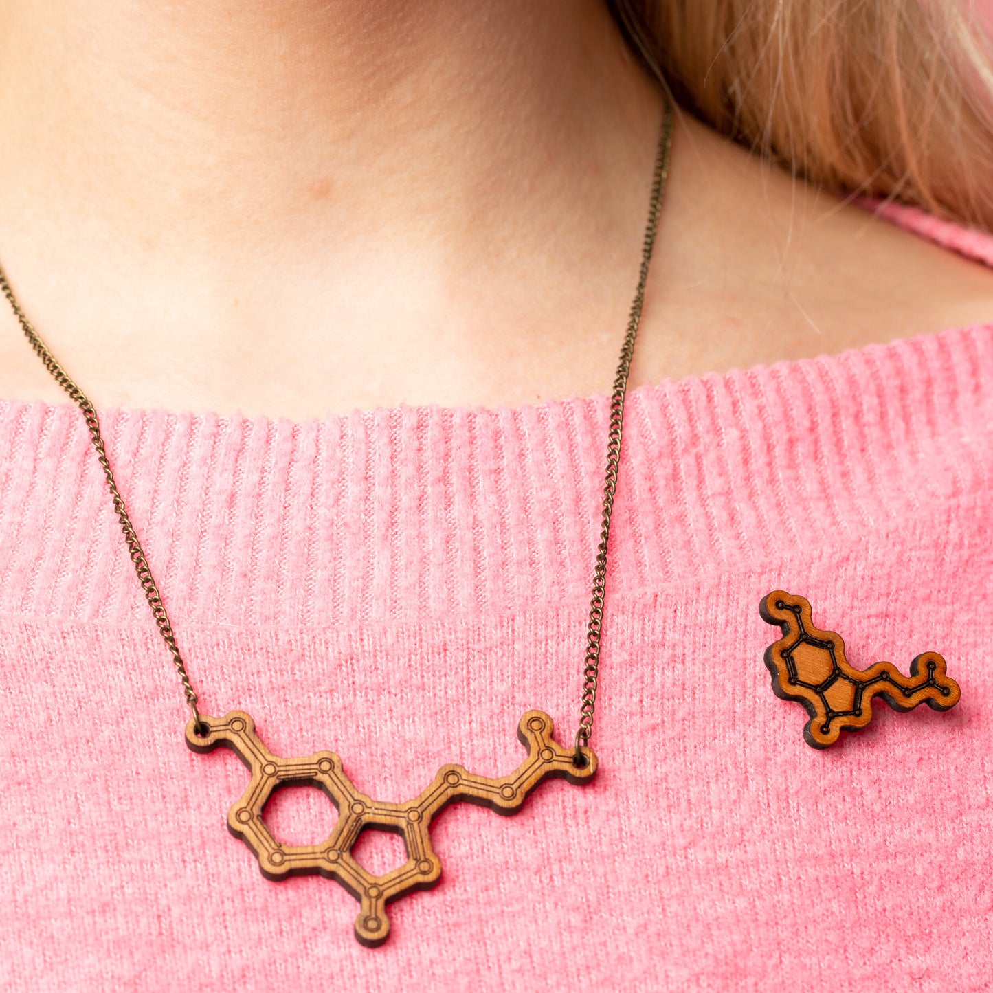 Serotonin molecule pin badge: 'Happiness chemical'