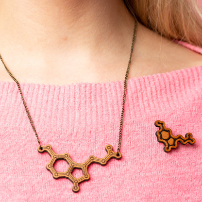 Serotonin molecule pin badge: 'Happiness chemical'